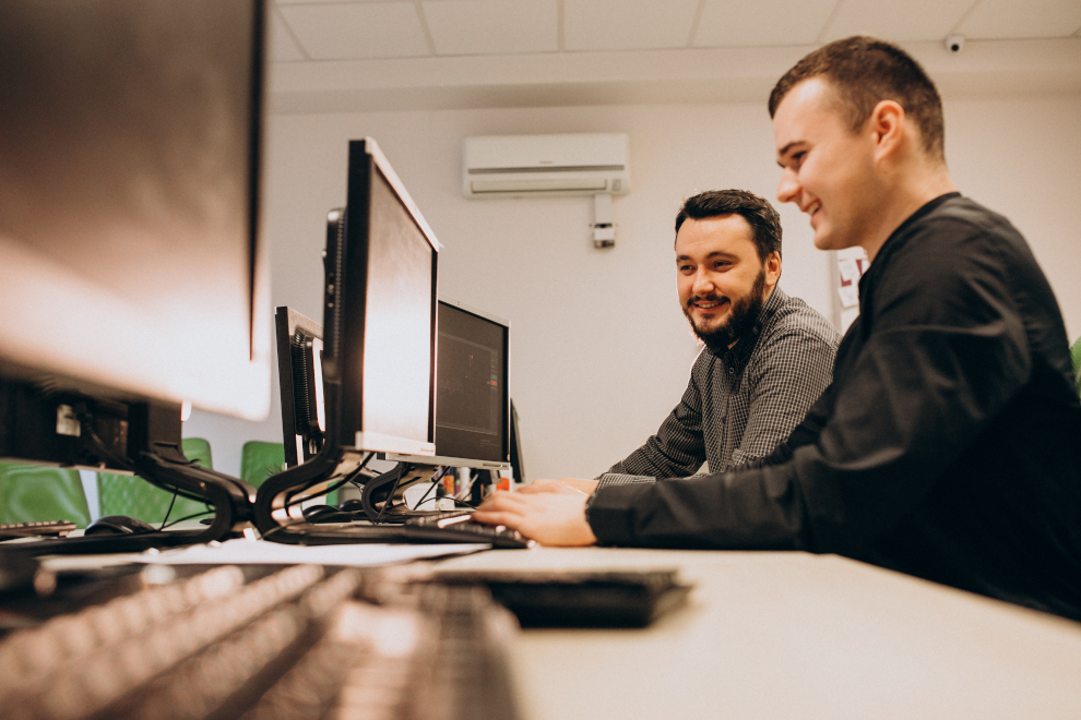 Young male web support working on a computer